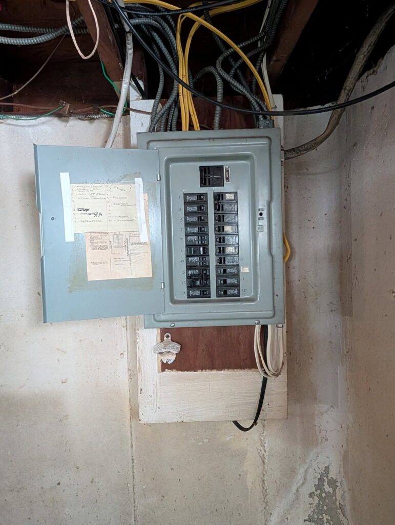 Before: an overloaded electrical panel in an Albany NY home