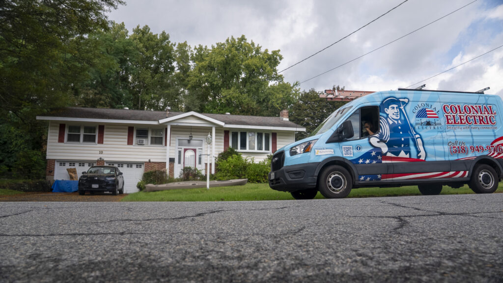 Colonial Electric service van parked outside a residential home in the Capital Region NY