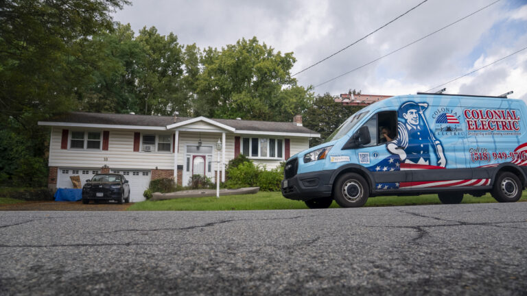 Colonial Electric service van parked outside a residential home in the Capital Region NY